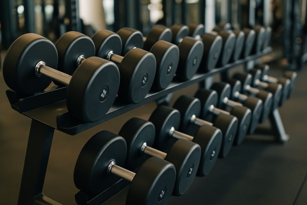 stay fit at the gym with use of dumbbells